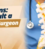 Spine surgeon in Abu Dhabi explaining signs that may require specialist spine assessment